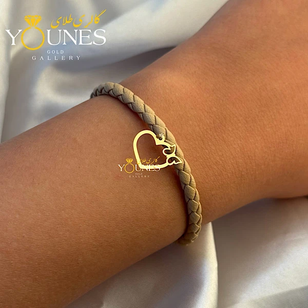 دستبند چرم کرمی پروانه قلبی طلا